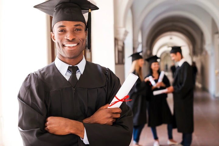 college graduate holding his diploma | Armstrong Subaru in McMinnville OR