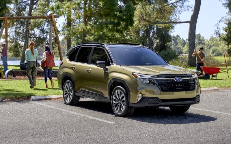 Green 2025 Subaru Forester parked at a community park.